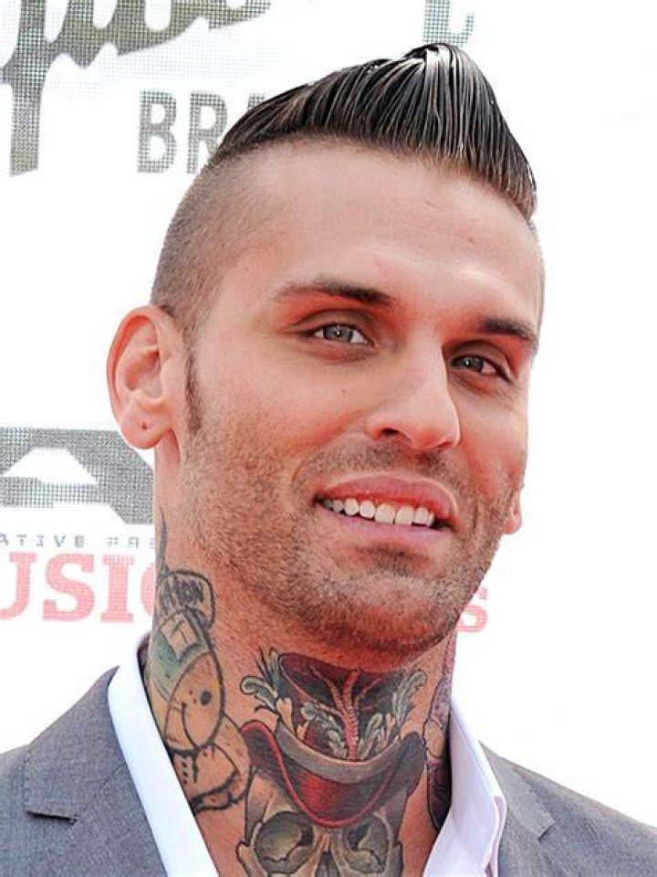 Corey Graves along with his present partner WWE star Carmella 