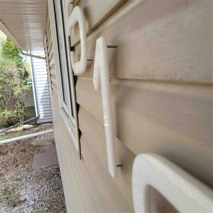 How do you install floating numbers on siding?