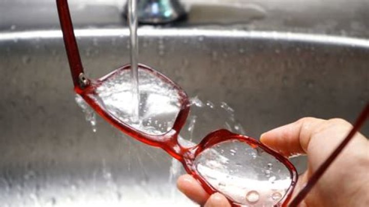 How do you remove residue from eyeglass frames?