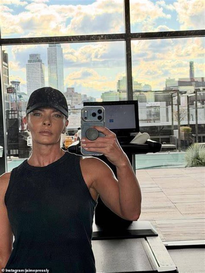 Jaime Pressly has her arms around Dezi James Calo as she is taking the selfie.