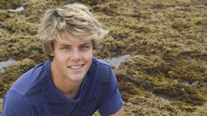 Lachlan wearing blue T-shirt with black pant. 