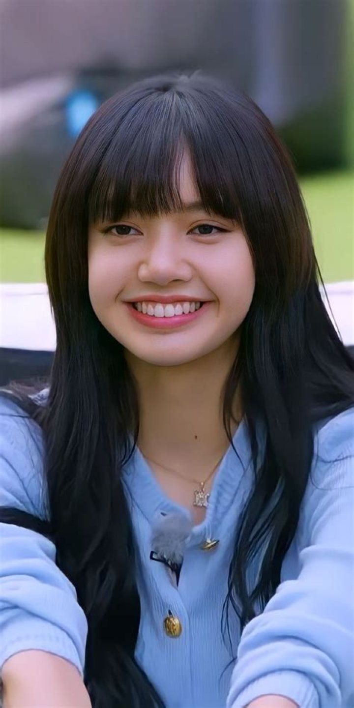 Lisa is smiling and getting her pictures clicked.