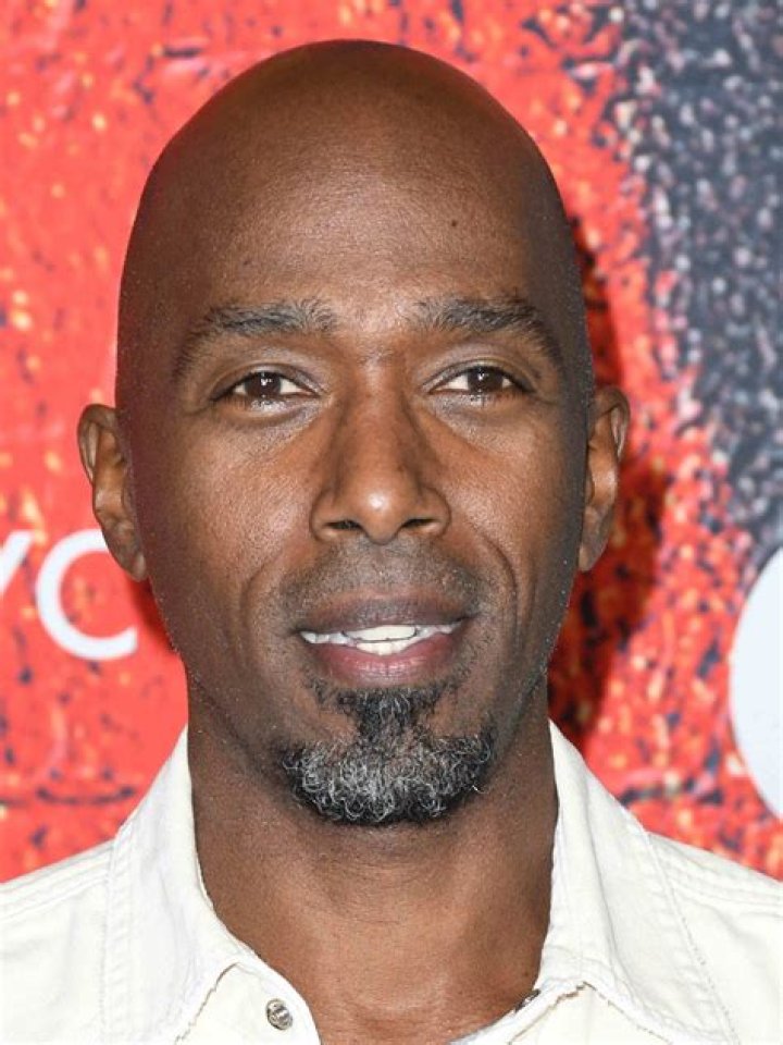 Ntare Guma Mbaho Mwine posing for a photo shoot.