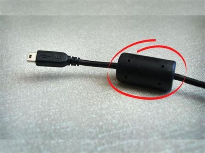 Why laptop charging cable has a small cylinder?